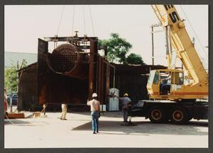 [Crane Lifting Tank at the Dr. Pepper Museum]