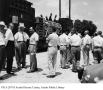 Photograph: [Men standing outside Seaholm Power Plant]