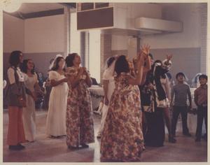 [Bouquet toss with bridesmaids and female guests at a wedding at the San Jose Community Center]