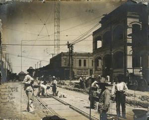 Brick laying crew, West Sixth Street, looking West