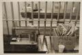 Photograph: [Sewing machine and mail bin in the Travis County Jail]