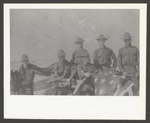 [Seven Soldiers WIth U.S. Flag]