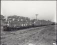 Primary view of [Cotton bales on a rail platform]
