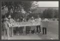 Photograph: [People at a Protest Holding a San Antonio, Texas Coalition Banner]