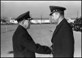 Photograph: [Retired Colonel Bailey Shakes Hands With Gentlemen]