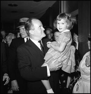 [Hubert Humphrey Holds Little Girl]
