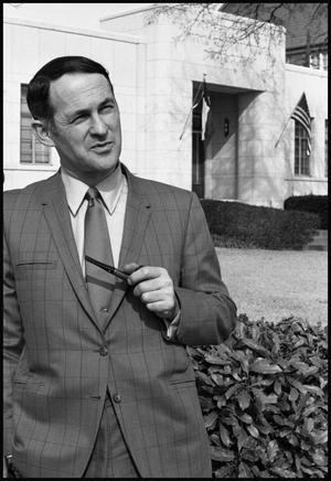 [Dr. Don Waldrip Smokes Pipe in Front of Administration Building]