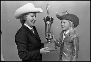 [Crane Women With Rodeo Trophy]