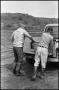 Photograph: [Men Lift Fish Buckets Off Truck]