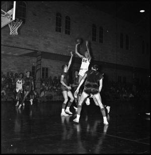 Primary view of object titled '[Basketball Player Takes a Shot]'.