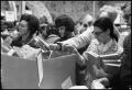 Primary view of [Crowd Browses Boxes of Books at McClurkan's White Elephant Store]