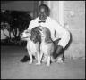 Photograph: [Butler Poses With LBJ's Dogs]