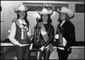 Photograph: [Rodeo Queens Hold Trophies]