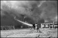 Photograph: [Two Men Battle White Warehouse Fire]