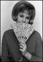 Photograph: [Woman Covers Mouth With Fan]