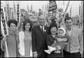 Photograph: [D.C. Norwood and Family Stand in Front of Crowd of Supporters]
