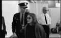 Photograph: [Woman Escorted by Police]