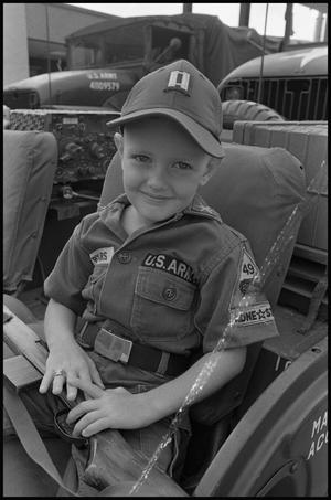 [Young Boy in Uniform at Armed Forces Day]