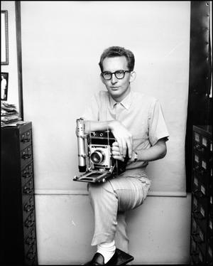 Primary view of object titled 'Jim Cochran With Camera'.