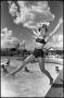 Photograph: [Girl Wearing Hat Jumps Into Pool]