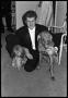 Primary view of [Van Cliburn Poses With Dogs]