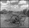 Thumbnail image of item number 1 in: '[Abandoned Wagon Axle Near Dirt Road]'.
