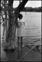 Photograph: [Young Girl Stands at Lake Shore]