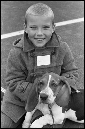 [Boy and His Basset Hound at Pet Fair]