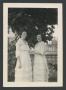 Photograph: [Two Women Wearing Light-Colored Dresses]