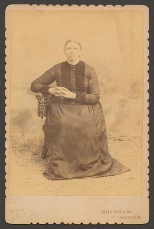 [Photograph of a Woman in Dark Clothing]