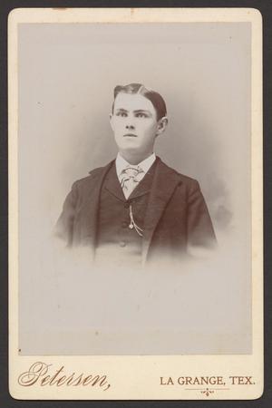[Photograph of a young clean shaven man]