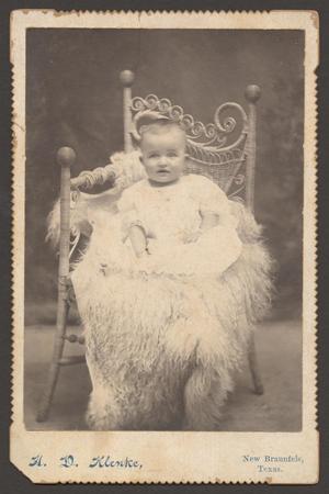 [Photograph of an Unknown Baby Sitting on Fur Fabric]