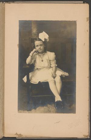 [Photograph of a Young Girl Wearing a Large Bow]