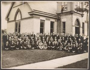 [Photograph of a Group of Men in Front of a Church]