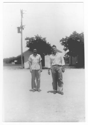 [Two Young Men Standing in the Road]