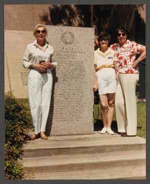 [Gayle Snell and two women standing next to WASP monument]