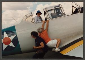 [Gayle Snell helping Friend onto SNJ Texan]