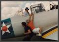 Primary view of [Gayle Snell helping Friend onto SNJ Texan]