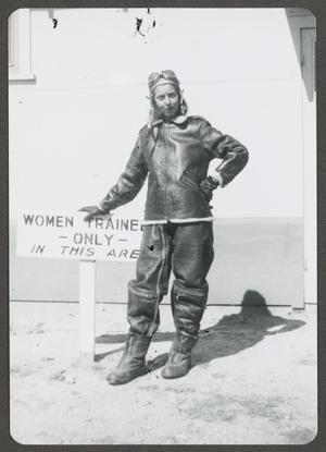 [WASP in Heavy Flight Gear next to "Women Trainees Only" Sign]