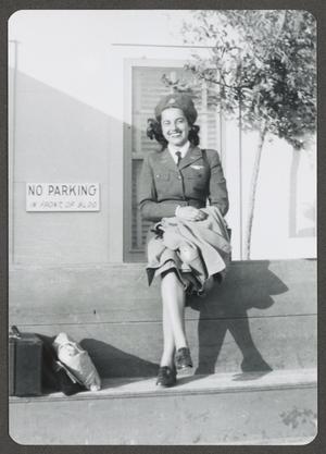 Primary view of object titled '[WASP Sitting next to "No Parking" Sign]'.