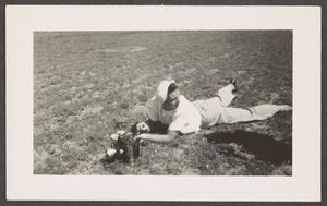Primary view of object titled '[Woman on Ground with Camera]'.