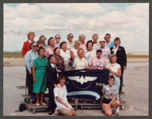 [WASP Veterans and Others with Flag]