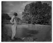Photograph: [Man Standing by River]