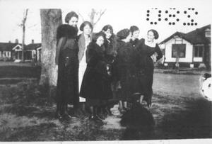 [Photograph of seven Sugar Land School teachers in front of a tree]