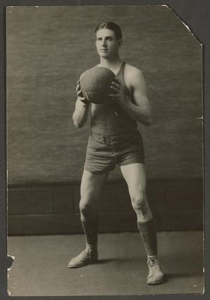 Primary view of object titled '[Dark Haired Basketball Player In Uniform]'.