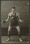 Photograph: [Basketball Player With His Hands Outstretched]