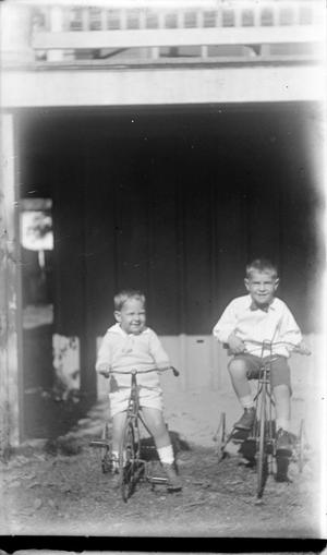 [Two Children on Tricycles #2]