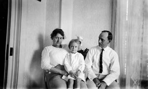 [Man, Woman, and Child Sit for a Photo #1]