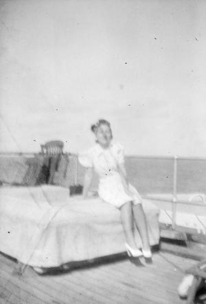 [Woman Sitting on a Boat on the Water]