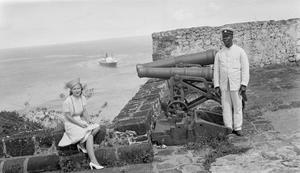 [Woman and Man Posing by Cannons]